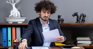 Tax accountant reviewing K 1 income from partnerships and S corporations