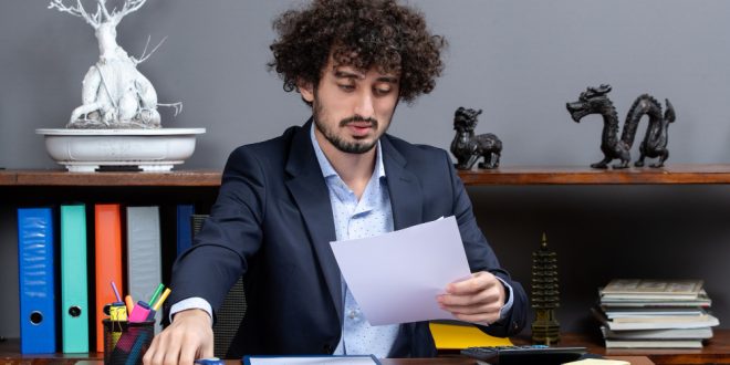 Tax accountant reviewing K 1 income from partnerships and S corporations